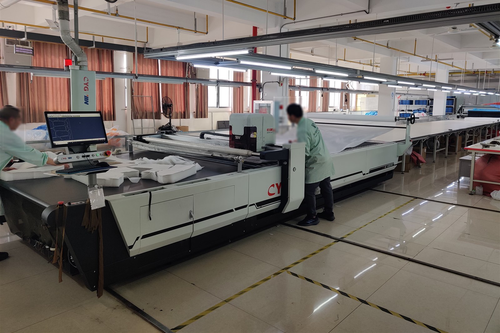 Automatic fabric cutting equipment in operation