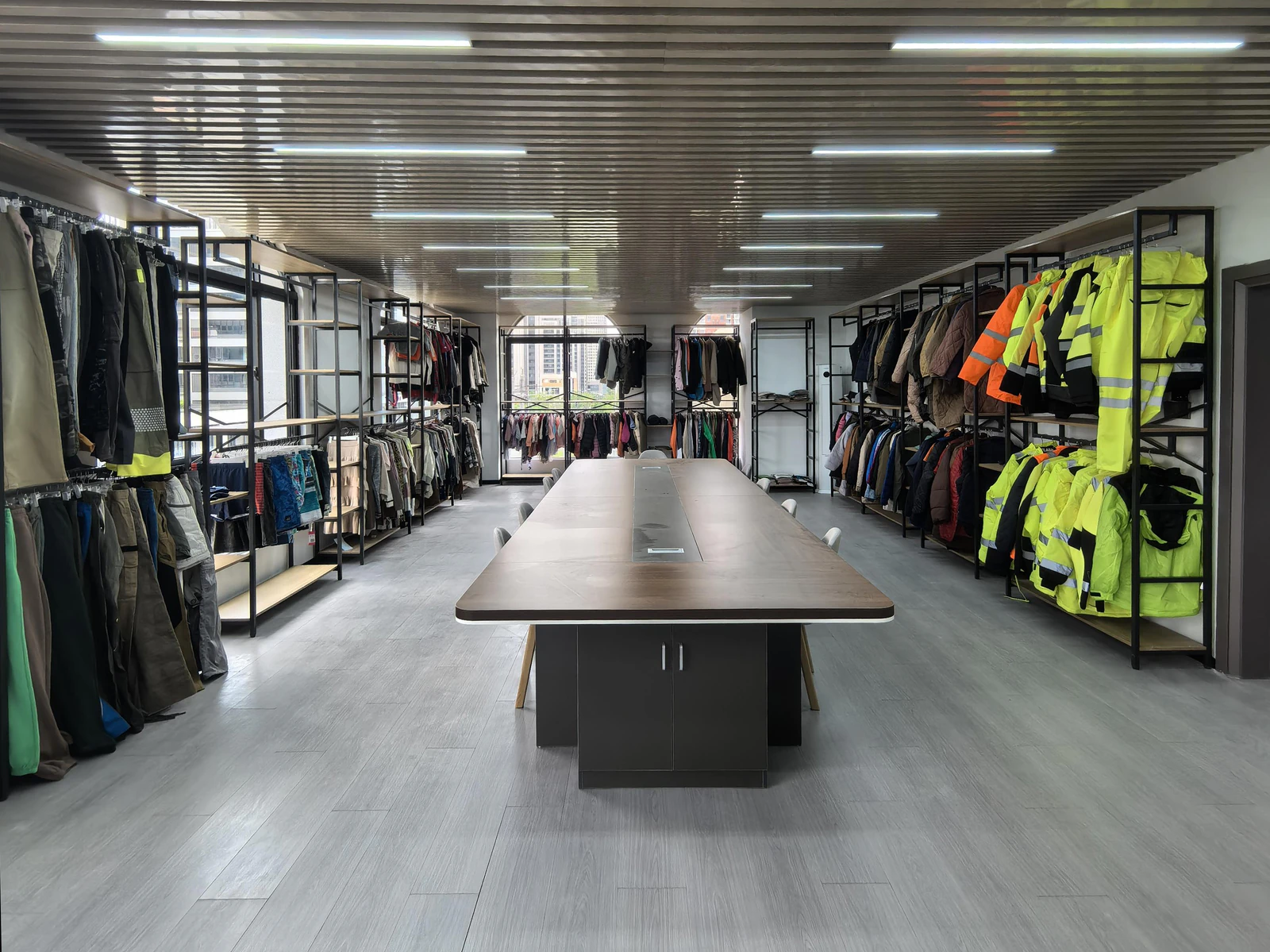 YALIDA workwear showroom with room depth and high-visibility garments on the right