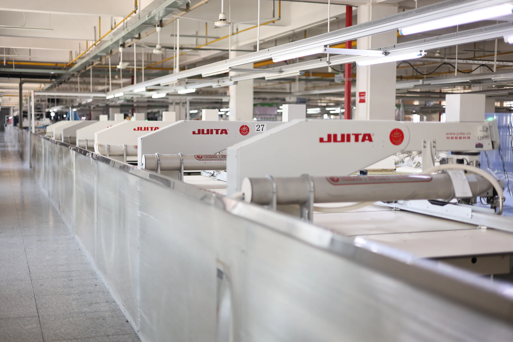 Rows of template sewing equipment within the YALIDA workshop